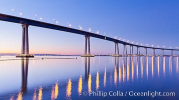 San Diego Coronado Bridge, linking San Diego to the island community of Coronado, spans San Diego Bay.  Dawn, lavender sky