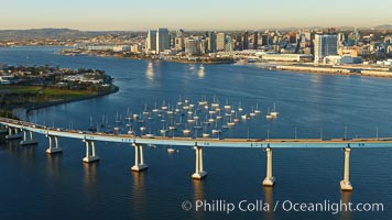 San Diego Coronado Bridge, known locally as the Coronado Bridge, links San Diego with Coronado, California.  The bridge was completed in 1969 and was a toll bridge until 2002.  It is 2.1 miles long and reaches a height of 200 feet above San Diego Bay.  Coronado Island is to the left, and downtown San Diego is to the right in this view looking north