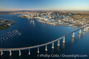 San Diego Coronado Bridge, known locally as the Coronado Bridge, links San Diego with Coronado, California.  The bridge was completed in 1969 and was a toll bridge until 2002.  It is 2.1 miles long and reaches a height of 200 feet above San Diego Bay.  Coronado Island is to the left, and downtown San Diego is to the right in this view looking north