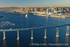 San Diego Coronado Bridge, known locally as the Coronado Bridge, links San Diego with Coronado, California.  The bridge was completed in 1969 and was a toll bridge until 2002.  It is 2.1 miles long and reaches a height of 200 feet above San Diego Bay.  Coronado Island is to the left, and downtown San Diego is to the right in this view looking north