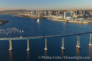 San Diego Coronado Bridge, known locally as the Coronado Bridge, links San Diego with Coronado, California.  The bridge was completed in 1969 and was a toll bridge until 2002.  It is 2.1 miles long and reaches a height of 200 feet above San Diego Bay.  Coronado Island is to the left, and downtown San Diego is to the right in this view looking north