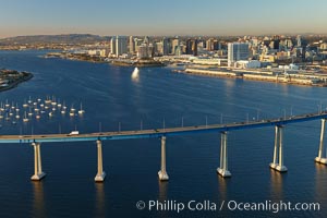 San Diego Coronado Bridge, known locally as the Coronado Bridge, links San Diego with Coronado, California.  The bridge was completed in 1969 and was a toll bridge until 2002.  It is 2.1 miles long and reaches a height of 200 feet above San Diego Bay.  Coronado Island is to the left, and downtown San Diego is to the right in this view looking north