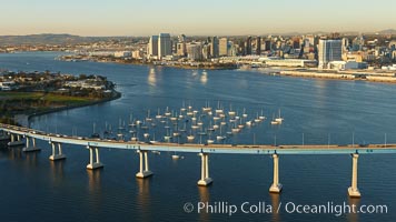 San Diego Coronado Bridge, known locally as the Coronado Bridge, links San Diego with Coronado, California.  The bridge was completed in 1969 and was a toll bridge until 2002.  It is 2.1 miles long and reaches a height of 200 feet above San Diego Bay.  Coronado Island is to the left, and downtown San Diego is to the right in this view looking north