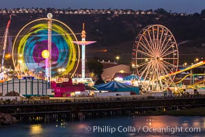 San Diego County Fair at night.  Del Mar Fair at dusk, San Dieguito Lagoon in foreground.