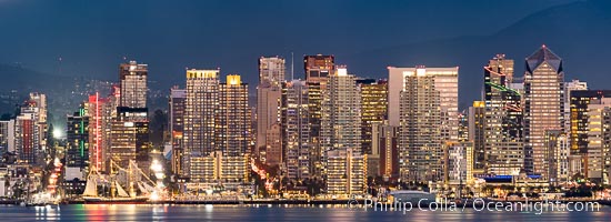San Diego Downtown Waterfront Skyline Panoramic Photograph, the city of San Diego is lit up just after sunset, the Star of India historic ship is seen at lower left. Viewed from Point Loma
