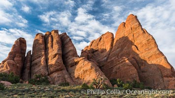 Sunrise light touches the Fins.  Sandstone fins stand on edge.  Vertical fractures separate standing plates of sandstone that are eroded into freestanding fins, that may one day further erode into arches, Arches National Park, Utah
