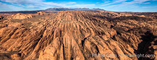 Sandstone Fins at sunset, near Moab Utah. Fins like these form in sandstone and eventually some will continue to erode until they form natural stone arches, such as those in Arches National Park