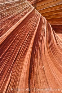 The Wave, an area of fantastic eroded sandstone featuring beautiful swirls, wild colors, countless striations, and bizarre shapes set amidst the dramatic surrounding North Coyote Buttes of Arizona and Utah.  The sandstone formations of the North Coyote Buttes, including the Wave, date from the Jurassic period. Managed by the Bureau of Land Management, the Wave is located in the Paria Canyon-Vermilion Cliffs Wilderness and is accessible on foot by permit only