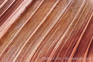 The Wave, an area of fantastic eroded sandstone featuring beautiful swirls, wild colors, countless striations, and bizarre shapes set amidst the dramatic surrounding North Coyote Buttes of Arizona and Utah.  The sandstone formations of the North Coyote Buttes, including the Wave, date from the Jurassic period. Managed by the Bureau of Land Management, the Wave is located in the Paria Canyon-Vermilion Cliffs Wilderness and is accessible on foot by permit only.