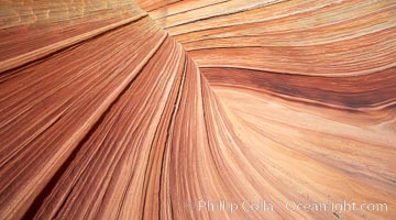 The Wave, an area of fantastic eroded sandstone featuring beautiful swirls, wild colors, countless striations, and bizarre shapes set amidst the dramatic surrounding North Coyote Buttes of Arizona and Utah.  The sandstone formations of the North Coyote Buttes, including the Wave, date from the Jurassic period. Managed by the Bureau of Land Management, the Wave is located in the Paria Canyon-Vermilion Cliffs Wilderness and is accessible on foot by permit only