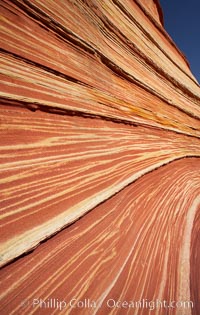 The Wave, an area of fantastic eroded sandstone featuring beautiful swirls, wild colors, countless striations, and bizarre shapes set amidst the dramatic surrounding North Coyote Buttes of Arizona and Utah.  The sandstone formations of the North Coyote Buttes, including the Wave, date from the Jurassic period. Managed by the Bureau of Land Management, the Wave is located in the Paria Canyon-Vermilion Cliffs Wilderness and is accessible on foot by permit only.