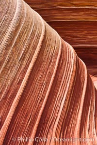 The Wave, an area of fantastic eroded sandstone featuring beautiful swirls, wild colors, countless striations, and bizarre shapes set amidst the dramatic surrounding North Coyote Buttes of Arizona and Utah.  The sandstone formations of the North Coyote Buttes, including the Wave, date from the Jurassic period. Managed by the Bureau of Land Management, the Wave is located in the Paria Canyon-Vermilion Cliffs Wilderness and is accessible on foot by permit only