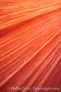 Sandstone striations.  Prehistoric sand dunes, compressed into sandstone, are now revealed in sandstone layers subject to the carving erosive forces of wind and water, North Coyote Buttes, Paria Canyon-Vermilion Cliffs Wilderness, Arizona