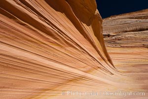 Sandstone striations.  Prehistoric sand dunes, compressed into sandstone, are now revealed in sandstone layers subject to the carving erosive forces of wind and water, North Coyote Buttes, Paria Canyon-Vermilion Cliffs Wilderness, Arizona