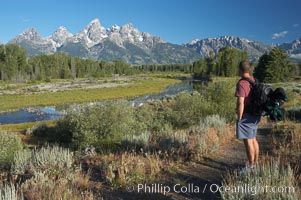 A hiker admires the Teton Range, Schwabacher Landing, Grand Teton National Park, Wyoming