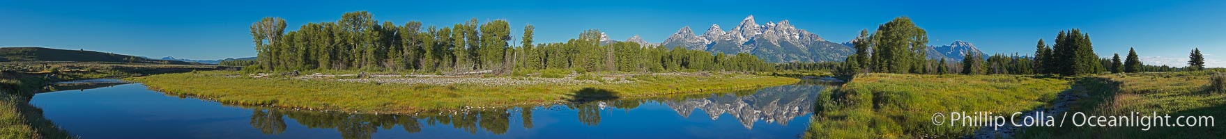 Panorama of the Teton Range reflected in the still waters of Schwabacher Landing, a sidewater of the Snake River, Grand Teton National Park, Wyoming.