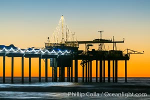 Scripps Institution of Oceanography Research Pier at sunset, with Christmas Lights and Christmas Tree.