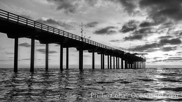 Scripps Pier, Surfer's view from among the waves. Research pier at Scripps Institution of Oceanography SIO, sunset, La Jolla, California