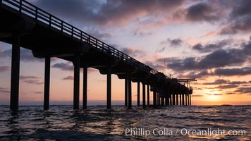 Scripps Pier, Surfer's view from among the waves. Research pier at Scripps Institution of Oceanography SIO, sunset, La Jolla, California