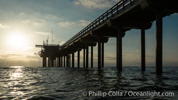 Scripps Pier, Surfer's view from among the waves. Research pier at Scripps Institution of Oceanography SIO, sunset, La Jolla, California