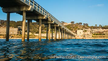 Scripps Pier, Surfer's view from among the waves. Research pier at Scripps Institution of Oceanography SIO, sunset, La Jolla, California