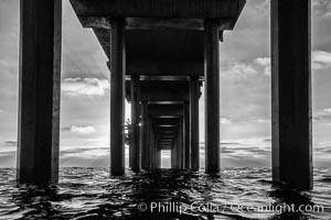 Scripps Pier, Surfer's view from among the waves. Research pier at Scripps Institution of Oceanography SIO, sunset, La Jolla, California