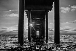 Scripps Pier, Surfer's view from among the waves. Research pier at Scripps Institution of Oceanography SIO, sunset, La Jolla, California