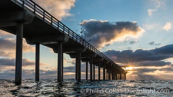 Scripps Pier, Surfer's view from among the waves. Research pier at Scripps Institution of Oceanography SIO, sunset, La Jolla, California