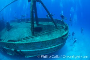 SCUBA divers on the wreck of the USS Kittiwake, sunk off Seven Mile Beach on Grand Cayman Island to form an underwater marine park and dive attraction