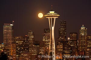 Full moon rises over Seattle city skyline, Space Needle at right