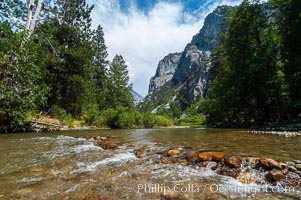 The South Fork of the Kings River flows through Kings Canyon National Park, in the southeastern Sierra mountain range. Grand Sentinel, a huge granite monolith, is visible on the right above pine trees. Late summer, Sequoia Kings Canyon National Park, California