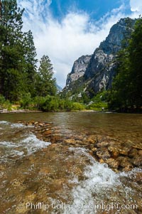 The South Fork of the Kings River flows through Kings Canyon National Park, in the southeastern Sierra mountain range. Grand Sentinel, a huge granite monolith, is visible on the right above pine trees. Late summer, Sequoia Kings Canyon National Park, California