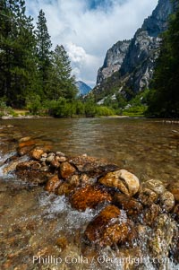 The South Fork of the Kings River flows through Kings Canyon National Park, in the southeastern Sierra mountain range. Grand Sentinel, a huge granite monolith, is visible on the right above pine trees. Late summer, Sequoia Kings Canyon National Park, California