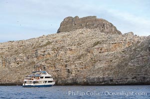 Sky Dancer, a liveaboard dive tour boat, at anchor, Wolf Island