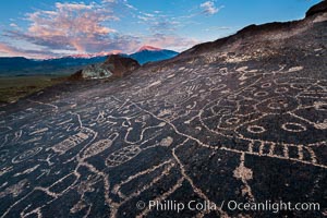 Sky Rock petroglyphs near Bishop, California.  Hidden atop an enormous boulder in the Volcanic Tablelands lies Sky Rock, a set of petroglyphs that face the sky.  These superb examples of native American petroglyph artwork are thought to be Paiute in origin, but little is known about them