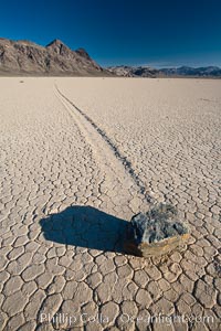 A sliding rock of the Racetrack Playa.  The sliding rocks, or sailing stones, move across the mud flats of the Racetrack Playa, leaving trails behind in the mud.  The explanation for their movement is not known with certainty, but many believe wind pushes the rocks over wet and perhaps icy mud in winter.