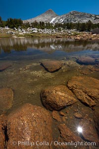 Small alpine lake, with Peak 11,100' rising above, late summer in the high Sierra Nevada near Vogelsang and Lake Evelyn, Yosemite National Park, California