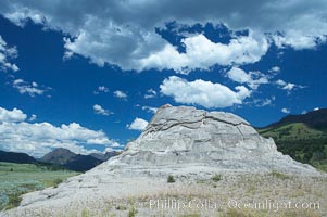 Soda Butte. This travertine (calcium carbonate) mound was formed more than a century ago by a hot spring. Only small amounts of hydrothermal water and hydrogen sulfide gas currently flow from this once more prolific spring, Yellowstone National Park, Wyoming