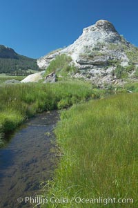 Soda Butte. This travertine (calcium carbonate) mound was formed more than a century ago by a hot spring. Only small amounts of hydrothermal water and hydrogen sulfide gas currently flow from this once more prolific spring, Yellowstone National Park, Wyoming