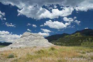 Soda Butte. This travertine (calcium carbonate) mound was formed more than a century ago by a hot spring. Only small amounts of hydrothermal water and hydrogen sulfide gas currently flow from this once more prolific spring, Yellowstone National Park, Wyoming