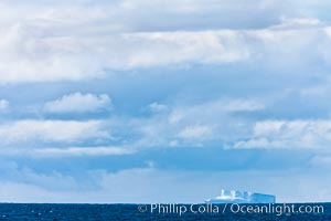 Clouds, weather and light mix in neverending forms over the open ocean of Scotia Sea, in the Southern Ocean