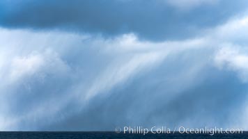 Clouds, weather and light mix in neverending forms over the open ocean of Scotia Sea, in the Southern Ocean