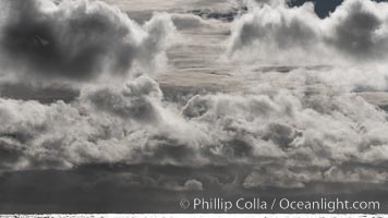 Clouds, weather and light mix in neverending forms over the open ocean of Scotia Sea, in the Southern Ocean