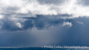 Clouds, weather and light mix in neverending forms over the open ocean of Scotia Sea, in the Southern Ocean