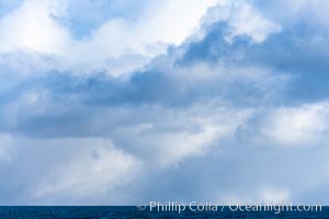 Clouds, weather and light mix in neverending forms over the open ocean of Scotia Sea, in the Southern Ocean