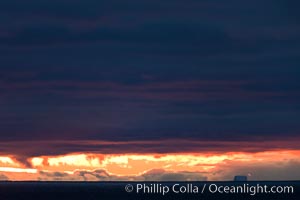 Clouds, weather and light mix in neverending forms over the open ocean of Scotia Sea, in the Southern Ocean