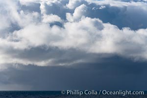 Clouds, weather and light mix in neverending forms over the open ocean of Scotia Sea, in the Southern Ocean