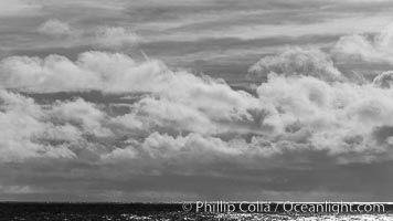 Clouds, weather and light mix in neverending forms over the open ocean of Scotia Sea, in the Southern Ocean