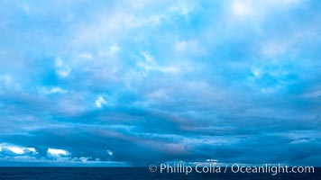 Clouds, weather and light mix in neverending forms over the open ocean of Scotia Sea, in the Southern Ocean