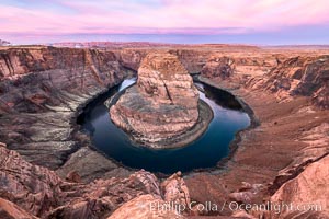 Spectacular Horseshoe Bend sunrise. The Colorado River makes a 180-degree turn at Horseshoe Bend. Here the river has eroded the Navajo sandstone for eons, digging a canyon 1100-feet deep, Page, Arizona